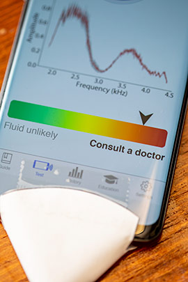 detail shot of smartphone app to detect middle ear fluid