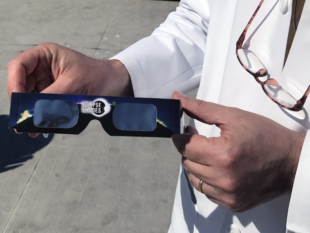 picture of a pair of eclipse viewing glasses that protect the eyes from retinal damage.