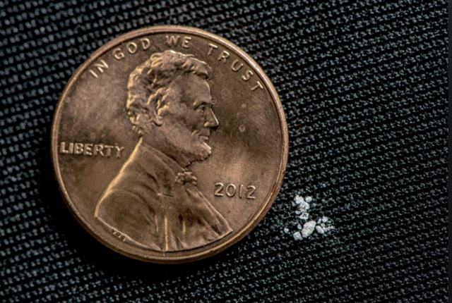 picture of a U.S. penny beside a small, deadly amount of fentanyl