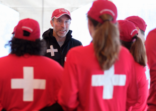 Dr. Mark Harrast talks with medical aid providers at the Seattle Marathon