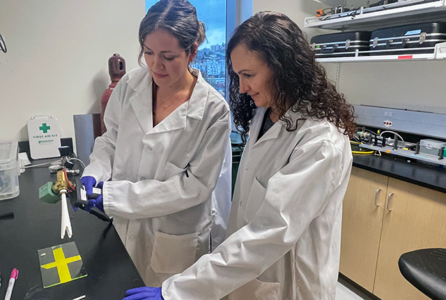 picture of scientists Hannah Frizzell and Deborah Fuller at the University of Washington School of Medicine