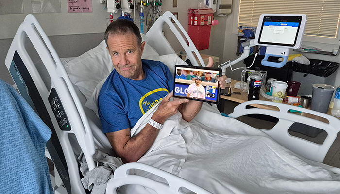 picture of patient Jan Patterson watching a baseball game while an inpatient at Harborview Medical Center