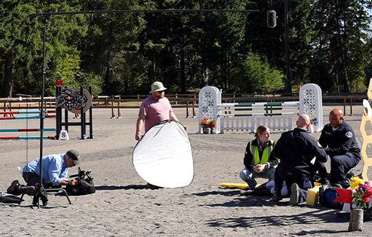 picture of video crew staging a shot at a horse training arena