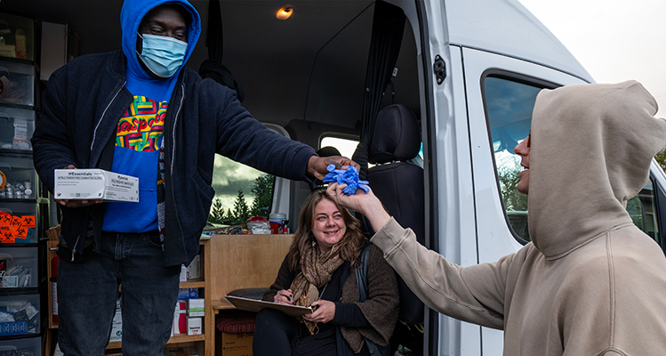 picture of man getting supplies from mobile syringe-services van