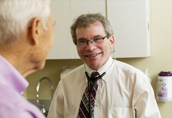 picture of Dr. Irl Hirsch with patient