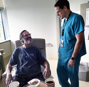 Patient Jere Gianola talks with surgeon Martin Montenovo.