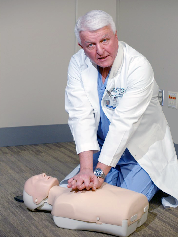 picture of Dr. Peter Kudenchuk with CPR manikin
