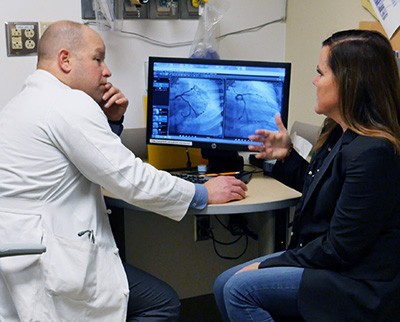 McCabe and Novak look over scans of her coronary arteries.