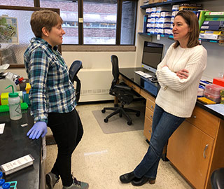 Heather Mefford in her lab with Alison Muir