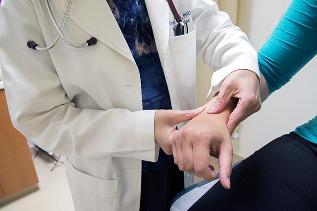 picture of doctor manipulating patient's wrist