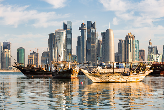 picture of fishing boats sit in the Persian Gulf along the coast of Doha, Qatar.