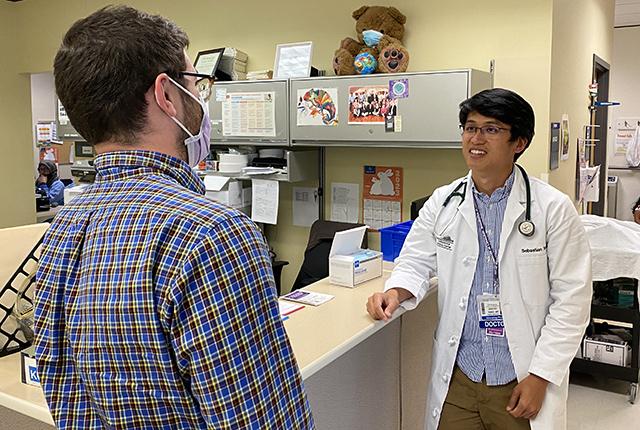 picture of Dr. Sebastian Tong working in clinic