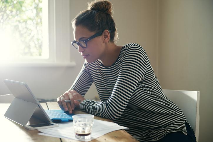 picture of adult woman looking at a laptop computer