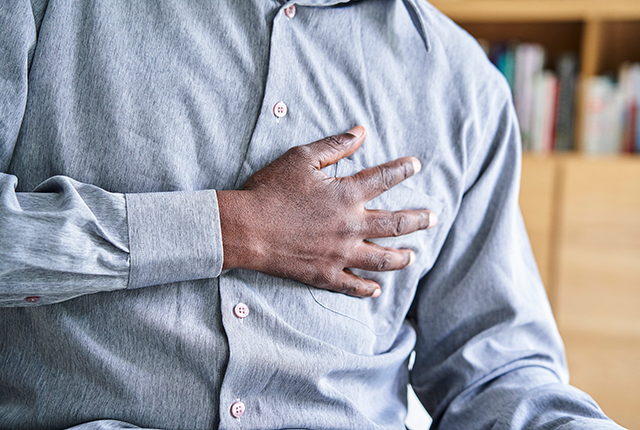 picture of a Black man clutching his chest