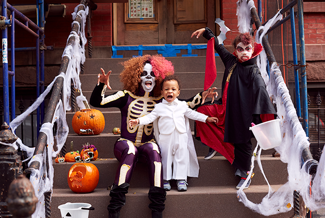 Picture of three people in Halloween costumes.