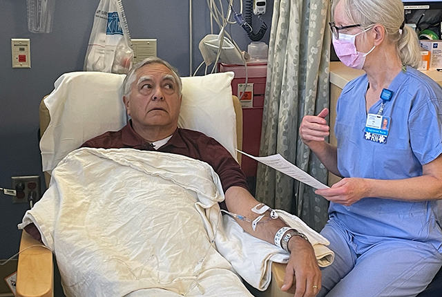 picture of nurse Niki Polkinghorn talking with patient Doug Davidson
