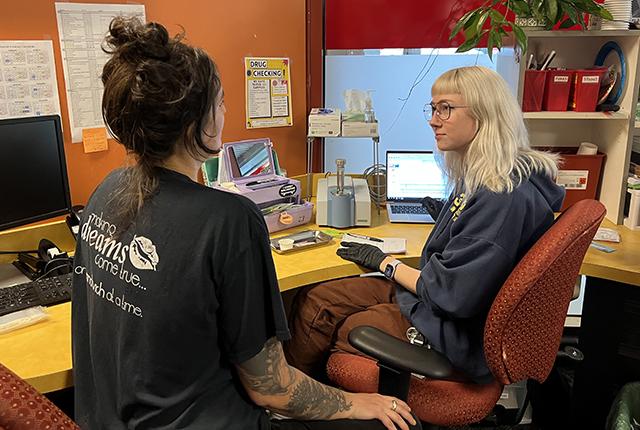 picture of a client and staffer at a syringe-services provider clinic