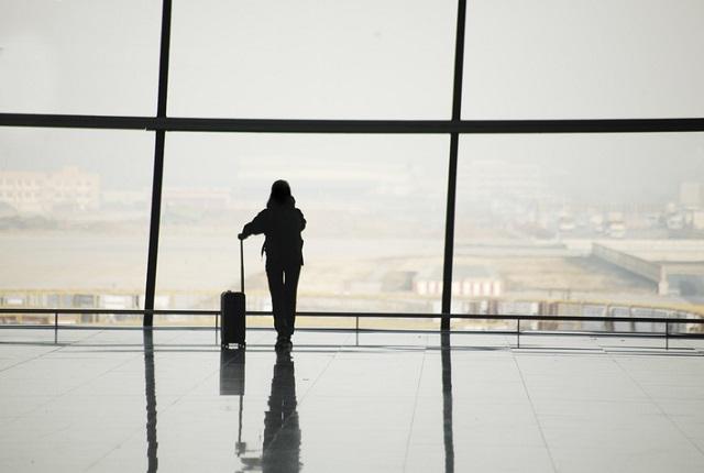 Woman standing at an airport
