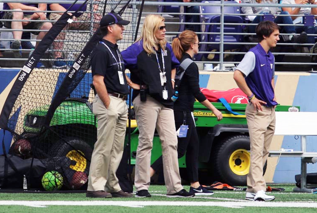picture of Dr. Kimberly Harmon on the sideline of a UW Huskies football game