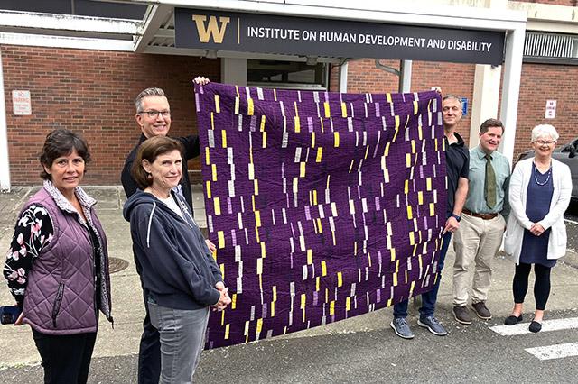 Donation of a quilt representing genetic testing to UW Medicine representatives
