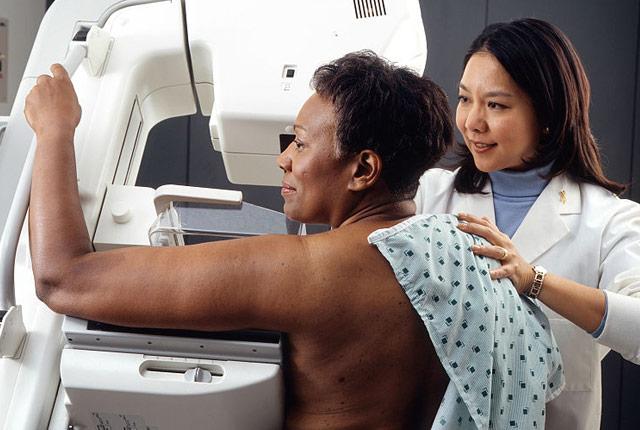 picture of a Black woman undergoing mammography screening
