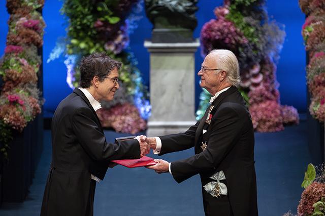 David Baker accepts the Nobel medal and diploma at the Stockholm award ceremony