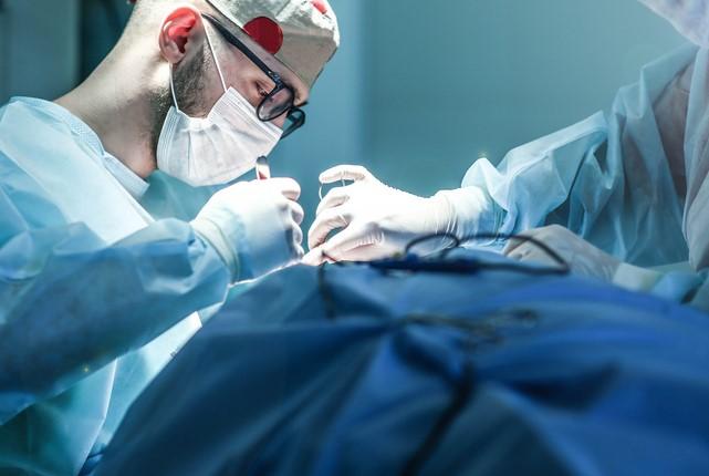 Surgeons operating on a patient