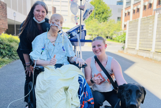 Patient, family and dog meet outside