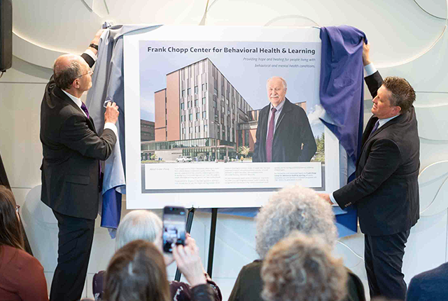 A memorial plaque is unveiled to honor Frank Chopp at the Center for Behavioral Health and Learning.
