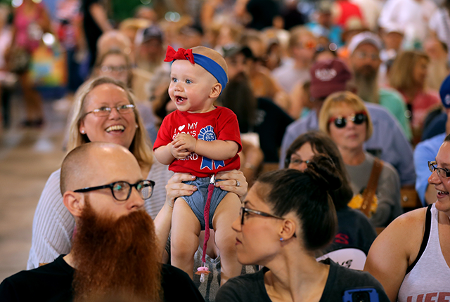 picture of a child in a crowded event space
