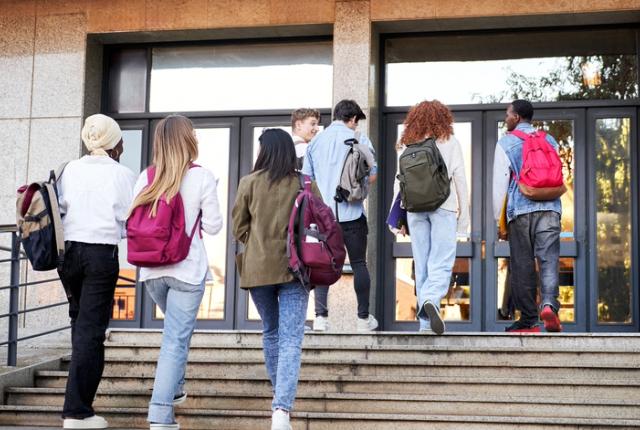 Adolescents enter a school before it starts