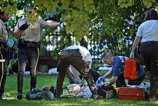 first-responders care for a man who had suffered a drug overdose