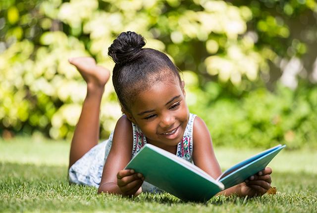 Media Name: child-reading-outside.jpg