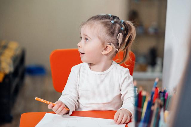 Media Name: child_with_cochlear_implant_smaller.jpg