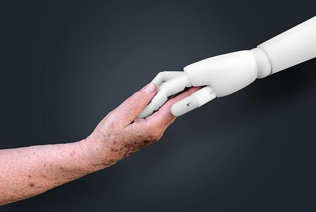 Media Name: robot-holds-older-womans-hand.jpg